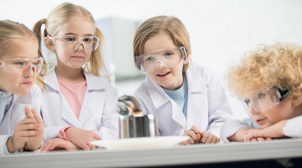 Kids in protective glasses - Фото, изображение