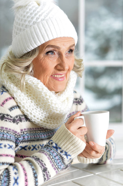 mature woman drinking tea - Photo, Image
