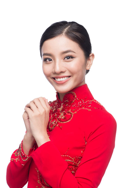 Young vietnamese woman in Ao Dai Dress with praying gesture wish - Photo, Image