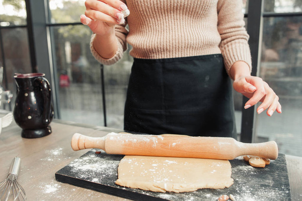 Unrecognizable woman rolling out dough free space - Foto, Bild