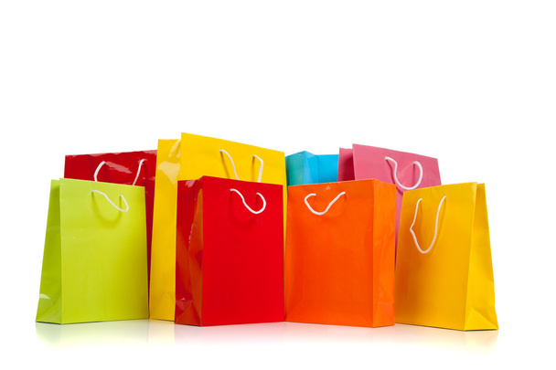 Assorted colored shopping bags on white - Photo, image
