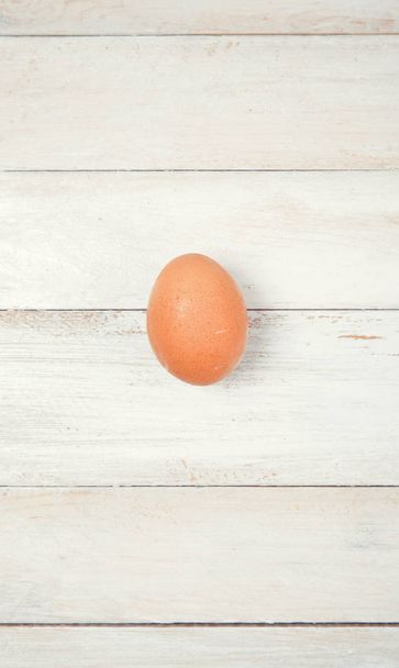 Raw chicken eggs on wooden background - Foto, Bild