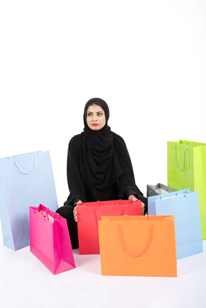 Beatuful Arab female shopping on white background - Photo, Image