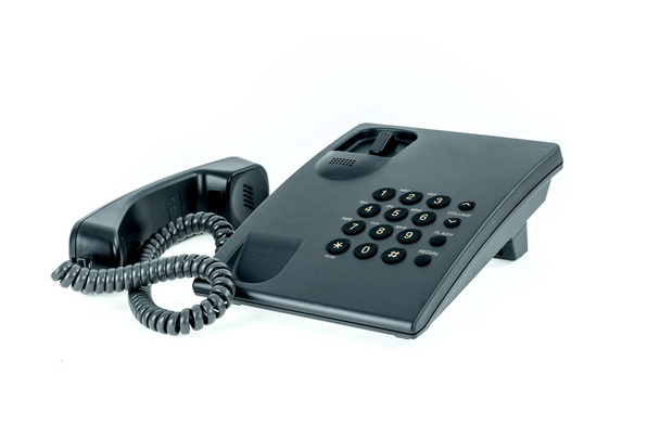 Teléfono de oficina negro con auricular cerca aislado en el fondo blanco
 - Foto, Imagen