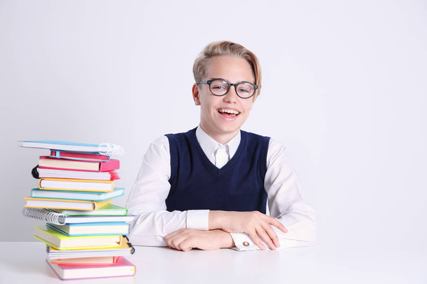 Pupil with pile of books - Foto, Bild