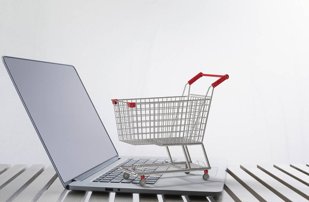online shopping concept with shopping cart on keyboard - Photo, Image