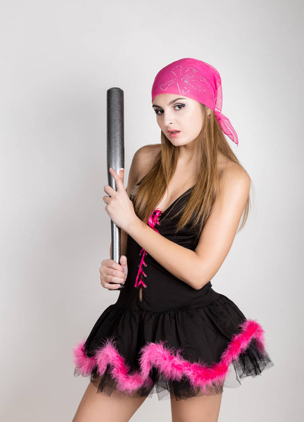 beautiful young woman in a short dress holding a baseball bat - Foto, immagini