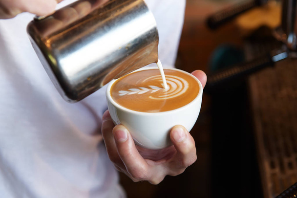 cup of latte art coffee  - Фото, зображення