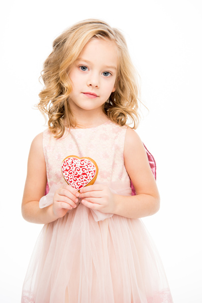Dívka, která soubor cookie ve tvaru srdce    - Fotografie, Obrázek