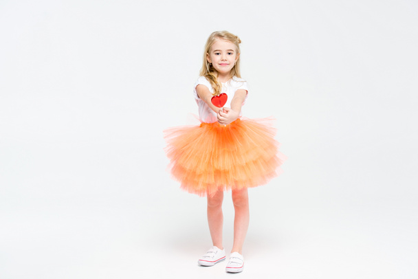 Girl with heart shaped lollipop - Фото, зображення
