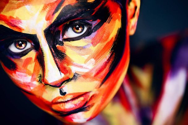 Portrait of the bright beautiful girl with art colorful make-up and bodyart - Photo, Image