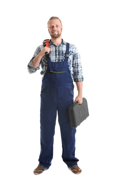 Handsome plumber with pipe wrench - Zdjęcie, obraz
