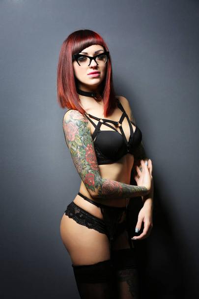 Beautiful girl with tattoo in black lingerie - Foto, Imagem