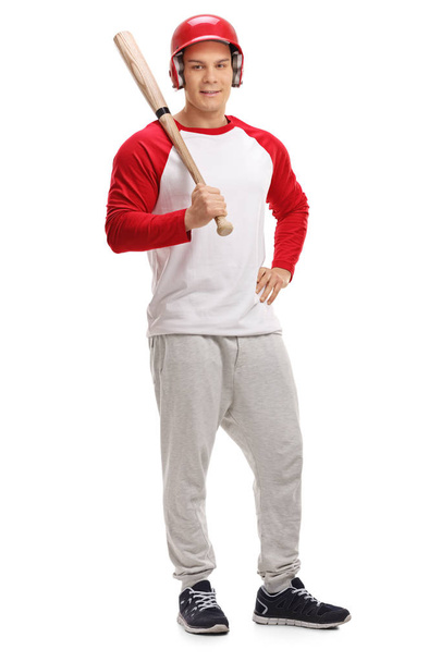Male baseball player posing with a bat - Foto, Imagen