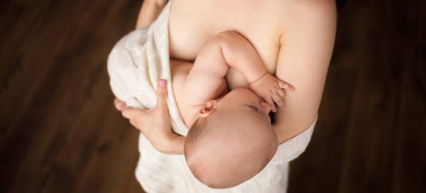 Mother is breastfeeding her baby. - Photo, Image