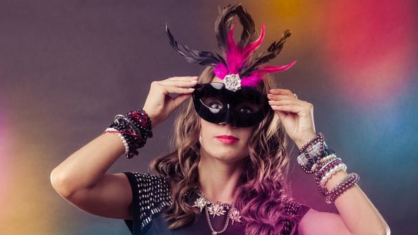 Woman with carnival venetian mask on dark - Фото, зображення