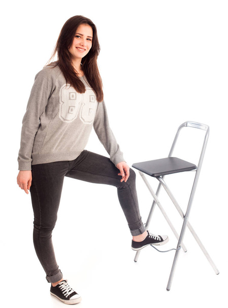 Womam stand near chair isolated - Zdjęcie, obraz