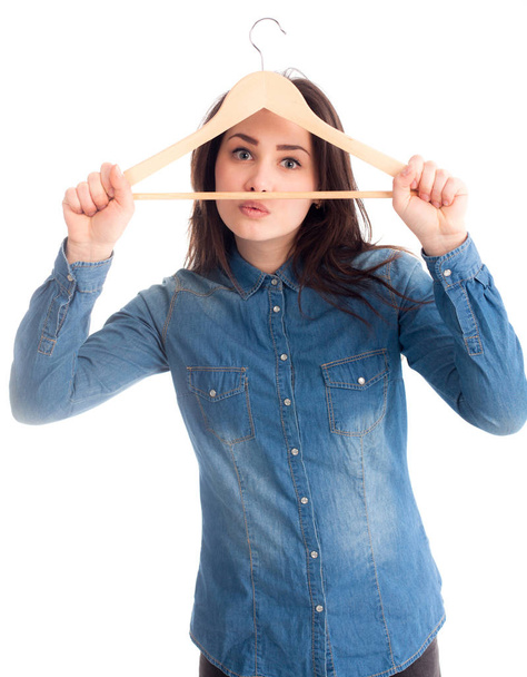 Girl hold hanger making funny face isolated - Foto, imagen