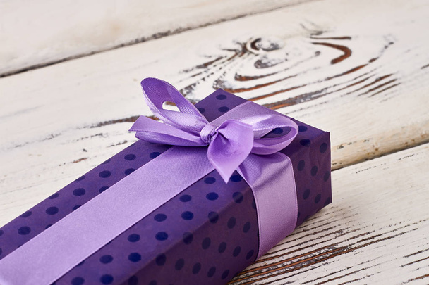 Bow on purple gift box. - Photo, Image