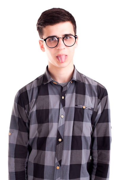 Caucasian boy showing tongue isolated - Fotó, kép