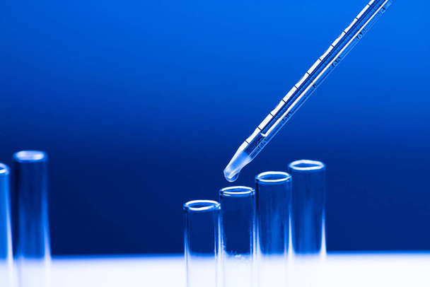 Dosage in laboratory blue light - Photo, Image