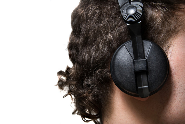 Man in headphones listening to music - Фото, изображение