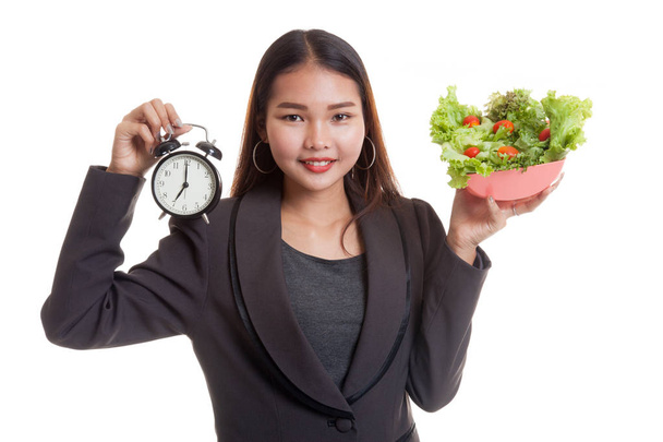 Young Asian business woman with clock and salad. - Fotografie, Obrázek