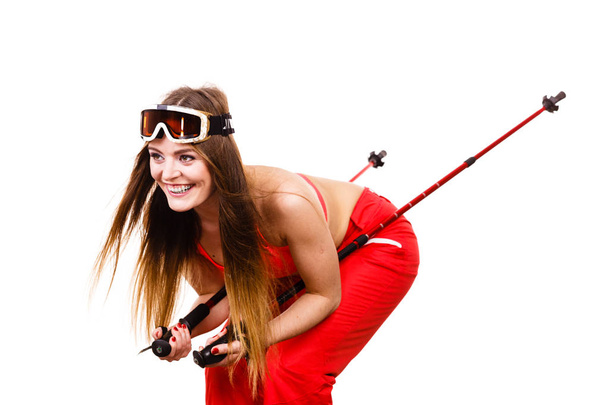 Woman skier in googles with ski poles. Winter sport - 写真・画像