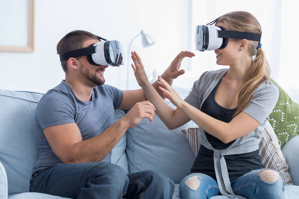 Happy couple wearing VR goggles - Фото, зображення