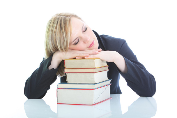 Tired blonde woman sleeping on books Tired blonde woman sleeping on books - Photo, Image