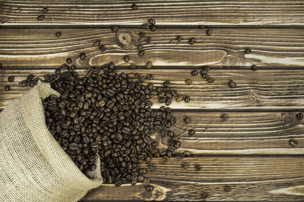 Saco de café sobre fondo de madera
 - Foto, Imagen