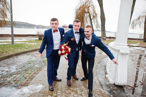 Groom with best mans at cold winter wedding day. - Valokuva, kuva