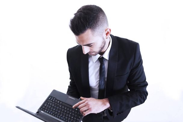 Portrait of young businessman with laptop isolated on white back - Photo, Image