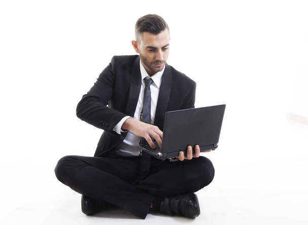 portrait of young businessman with laptop isolated on white back - Valokuva, kuva