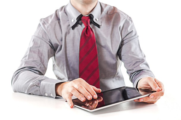 Young business man executive using a digital pc tablet - Fotó, kép