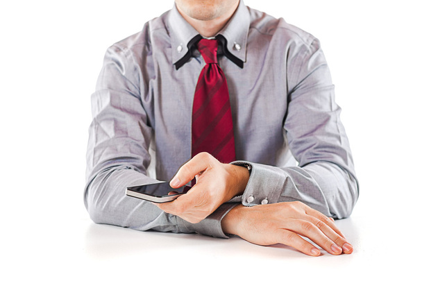 Close up of a business man using a mobile phone - Foto, afbeelding