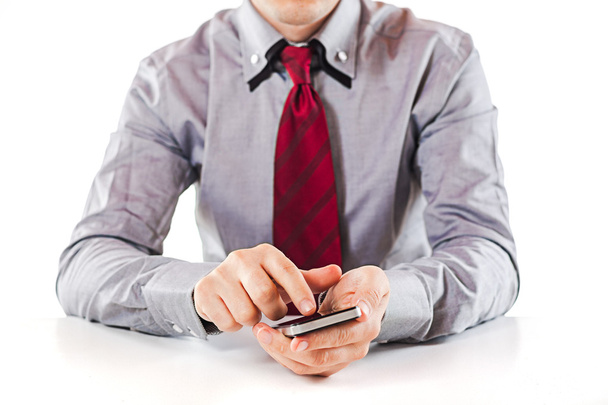 Close up of a business man using a mobile phone - Foto, immagini
