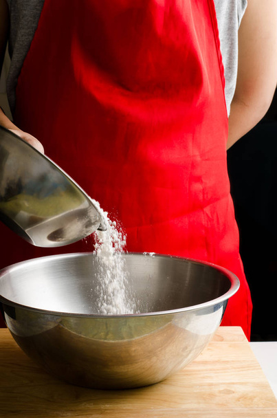 Pouring flour in the bowl  - Foto, Imagem