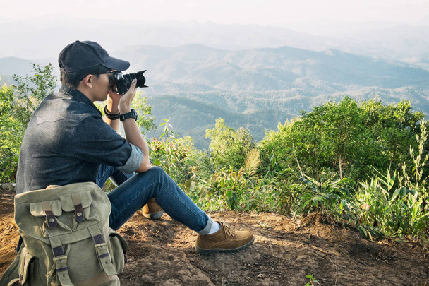 Young professional travrler man with camera shooting outdoor, fa - Φωτογραφία, εικόνα
