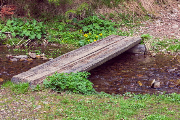 wooden crossbar over a stream  - Photo, Image