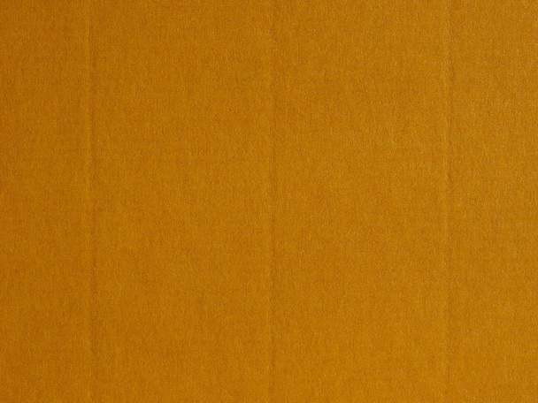 Light brown paper surface useful as a background - Photo, Image