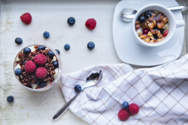 cooked red quinoa with berries and apple breakfast in a bowl - Fotografie, Obrázek