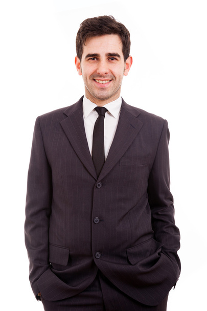 Portrait of handsome young business man smiling over white background - Fotó, kép