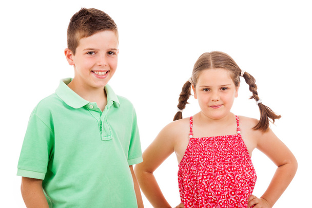 Two children standing over white background - Foto, afbeelding
