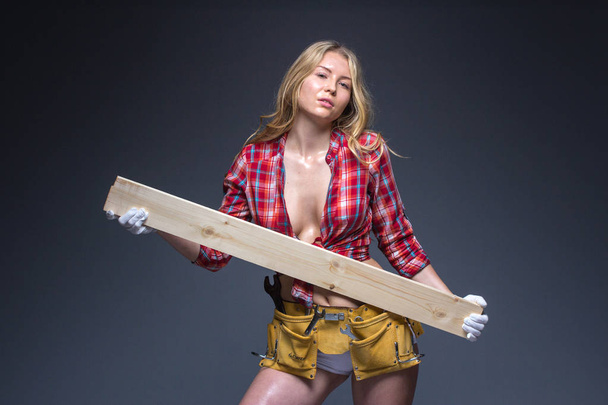 Portrait of young female construction carpenter  - Φωτογραφία, εικόνα