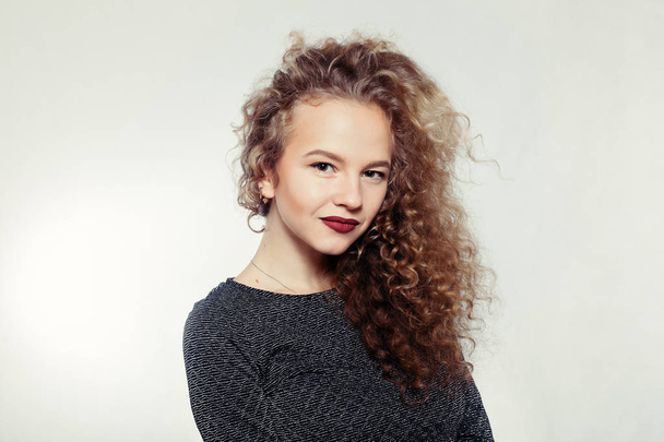 Beauty young woman with curly big and long hair. - 写真・画像