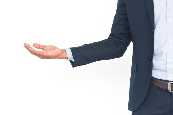 Homem de negócios com braço para fora em um gesto acolhedor
 - Foto, Imagem
