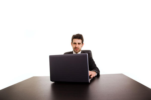Portrait of happy business man with laptop at office desk - Фото, изображение
