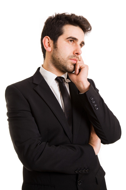 Pensive businessman on white background - 写真・画像