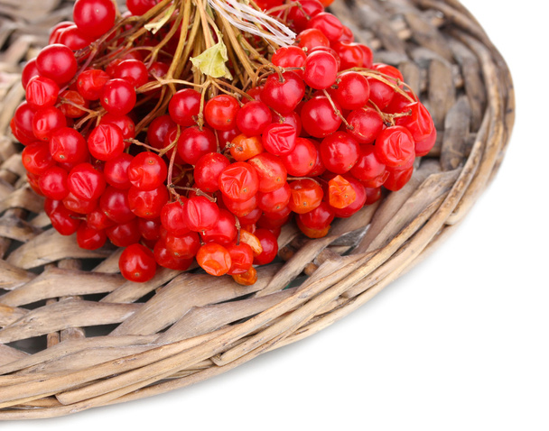 red berries of viburnum on wicker mat close-up - Valokuva, kuva